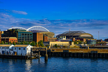 2024-08-15 VIEW OF THE WATERFRONT PIERS ALONG ELLIOTT BAY WITH THE SOD AREA AND THE BASEBALL AND FOOTBALL STADIUMS IN SEATTLE WASHINGTON