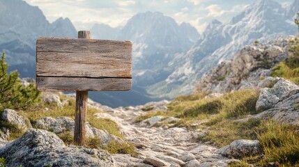 Blank wooden sign with a rough, weathered texture, standing on a rocky path in a mountain setting