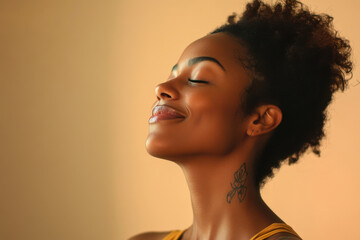 A close up of a tattooed black woman's face with her eyes closed