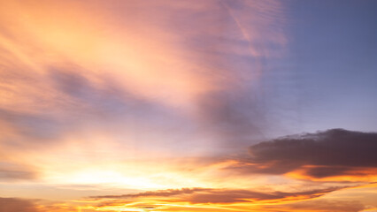 Obraz premium Beautiful , luxury soft gradient orange gold clouds and sunlight on the blue sky perfect for the background, take in everning,Twilight, Large size, high definition landscape photo