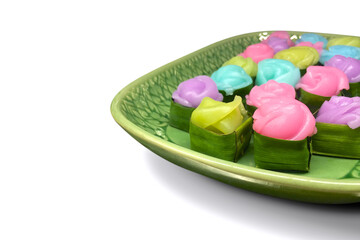 Thai desserts layer cake in rose shape or Khanom Chan with banana leaf isolated on white background.