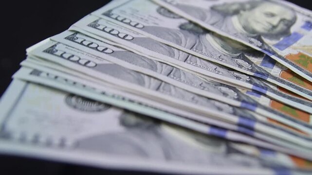 Dollars, American banknotes value of 100, rotate. Close-Up of banknotes. Hundred dollar bill close up in camera motion. Dollars money. 100 dollars Us