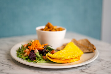 Breakfast plate with omelette isolated.