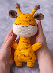 Knitted toy amigurumi giraffe handmade.