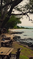 Fototapeta premium Ocean View with Palm Trees and Wooden Tables