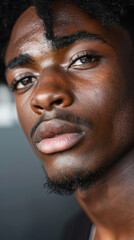 Fototapeta premium Close-up shot of a South African male fashion model with intense expression and clear skin