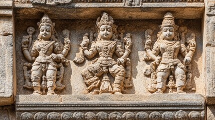 Detailed shot of a carved stone panel from an Indian temple, with ancient mythological figures depicted in fine detail.