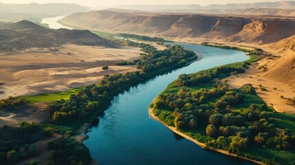 Fototapeta premium Overhead view of the Nile River winding through Egypt, with lush greenery on its banks contrasting with the arid desert landscape.