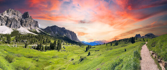 Breathtaking panoramic photo capturing a stunning blue hour sunset over the Passo di Falzarego mountains in Cortina d'Ampezzo,  Dolomites Italy