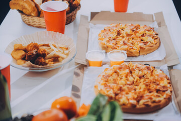 Group of young friends eating pizza.Home party.