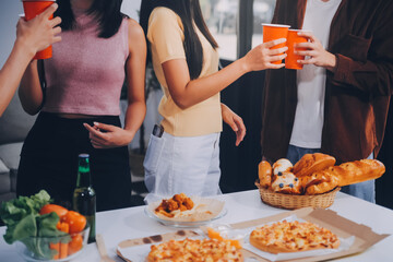 Group of young friends eating pizza.Home party.