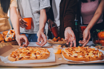 Group of young friends eating pizza.Home party.