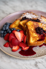French toast with strawberry, blueberry and blackberry.