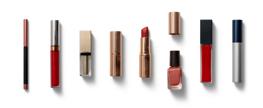 Various cosmetics including lipsticks, glosses, and nail polish are elegantly arranged on a white background, showcasing vibrant colors and textures