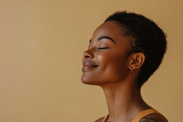 A close up of a tattooed black woman's face with her eyes closed