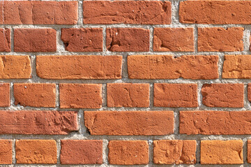 Close-up of a red brick wall. rough, aged bricks. Background and texture