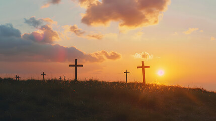 Obraz premium wooden crosses on the hill with a sunset background