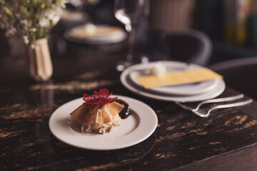 Table with dishes and serving during dinner. Catering and haute cuisine concept. Snacks, waiter, food.