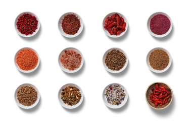 Various spices are neatly arranged in bowls, showcasing vibrant colors and diverse textures, perfect for enhancing dishes and culinary creativity