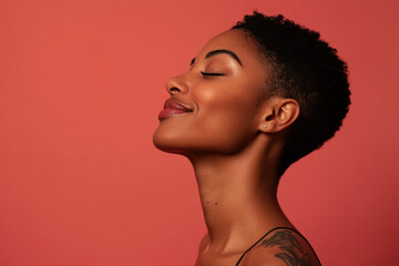 A close up of a tattooed black woman's face with her eyes closed