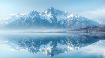 Obraz premium A majestic snow-covered mountain is perfectly reflected in the calm waters of a lake, creating a serene and breathtaking natural landscape.