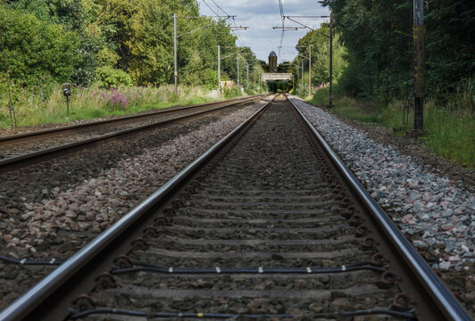 Parallel railway tracks heading towards a church tower at the vanishing point provide an excellent example of how perspective works in art and nature