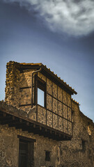 Pompeii's haunting ruins bask in golden light. Ancient stone walls and restored wooden balcony...
