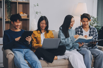 Young friends doing school assignment together at home