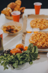 Group of young friends eating pizza.Home party.