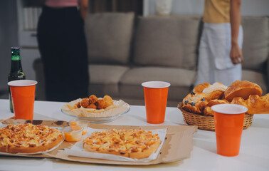 Group of young friends eating pizza.Home party.