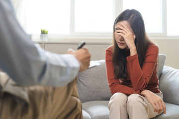 Psychology, depression. Sad asian young woman consultation with psychologist while patient...