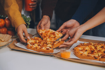 Group of young friends eating pizza.Home party.