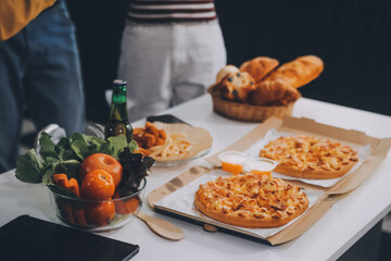 Group of young friends eating pizza.Home party.