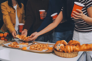 Group of young friends eating pizza.Home party.