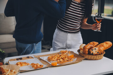 Group of young friends eating pizza.Home party.