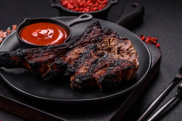 Juicy grilled beef tomahawk steak with salt, spices and herbs