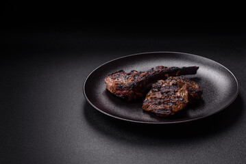 Juicy grilled beef tomahawk steak with salt, spices and herbs