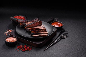 Juicy grilled beef tomahawk steak with salt, spices and herbs