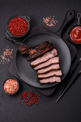 Juicy grilled beef tomahawk steak with salt, spices and herbs