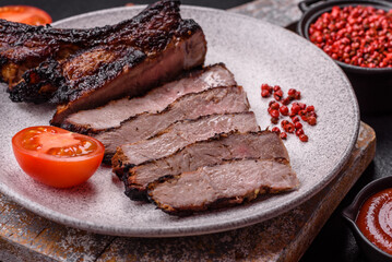 Juicy grilled beef tomahawk steak with salt, spices and herbs