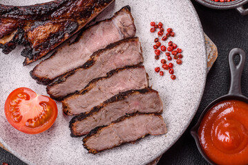 Juicy grilled beef tomahawk steak with salt, spices and herbs