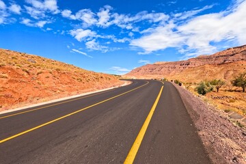 Empty Asphalt Road through Mountains