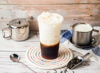 Iced Fragrant winter melon milk with sugar pot and spoon served in disposable glass isolated on...