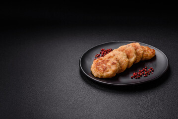 Delicious fresh fried minced fish cutlets with spices and herbs