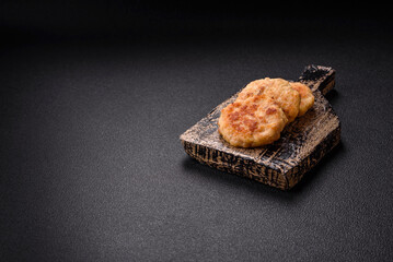 Delicious fresh fried minced fish cutlets with spices and herbs