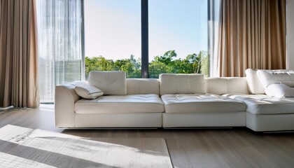 Modern White Sofa in a Minimalist Living Room with Large Windows and Natural Light