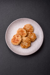 Delicious fresh fried minced fish cutlets with spices and herbs