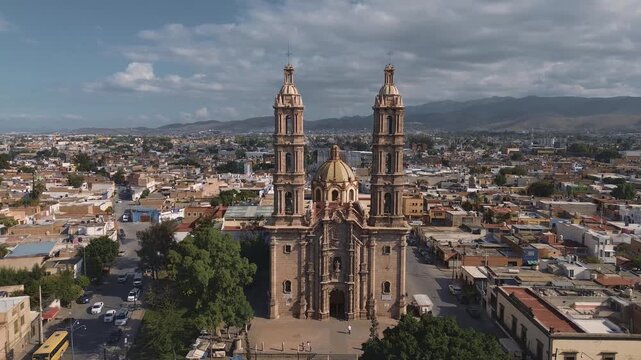 San luis potosi Aerial view of the church Parroquia Basilica Santuario de Nuestra Se&ntilde;ora de Guadalupe during sunset with the city in the background, beautiful religious catholic architecture