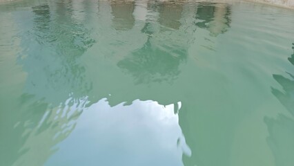 Still Pool Water with Sky Reflection in Outdoor Space