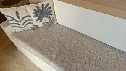 Textured Grey Cushion on Minimalist Wooden Bench